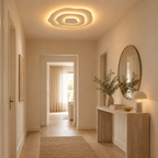 Lagune Plafonnier LED Ondulé – dans une entrée avec miroir rond et console