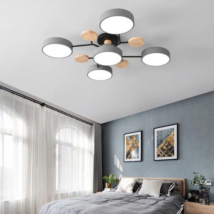Orbes Plafonnier LED en Métal – disques blancs dans une pièce bleu-gris
