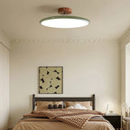 Médaillon Plafonnier LED Rond – dans une chambre avec tableau au-dessus du lit