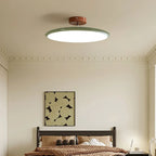 Médaillon Plafonnier LED Rond – dans une pièce beige avec tableau décoratif