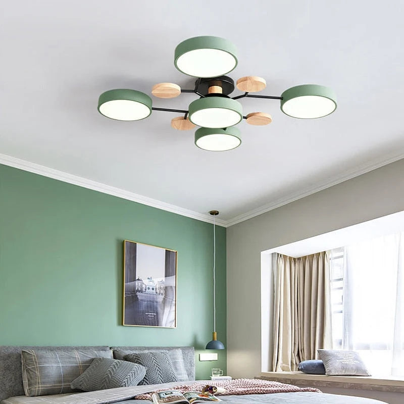 Orbes Plafonnier LED en Métal – disques verts et blancs devant un mur vert
