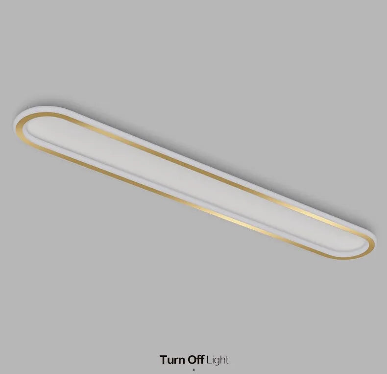 Piste Plafonnier LED Oblong – plafonnier doré, vue en perspective sur fond gris