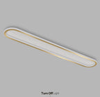 Piste Plafonnier LED Oblong – plafonnier doré, vue en perspective sur fond gris