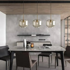 Ambra Suspension en Verre Ambré, 5 Formes au Choix – trois suspensions au-dessus d'une table devant un mur gris