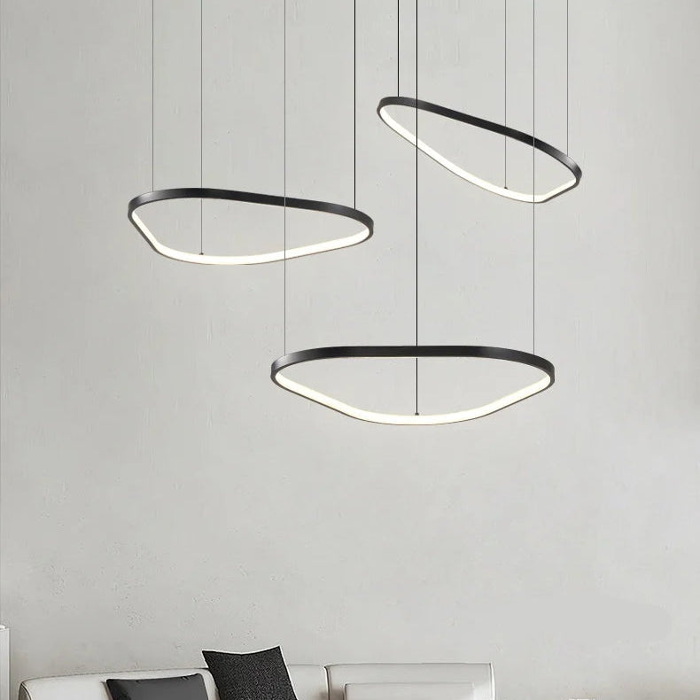 Orbite Duo Lustre 2 Anneaux LED Moderne – deux anneaux devant un mur gris