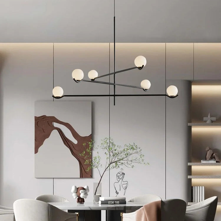 Perla Lustre à Globes en Verre – installé dans un salon avec niche décorative