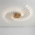 Éclat Plafonnier LED Étoilé – vue de dessous des bras dorés sur plafond blanc