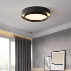 Duo Plafonnier LED Double Cercle – plafonnier noir dans une pièce grise aux rideaux