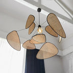 Fronda Suspension Feuillage en Rotin Tressé – feuilles en rotin autour d'une ampoule visible