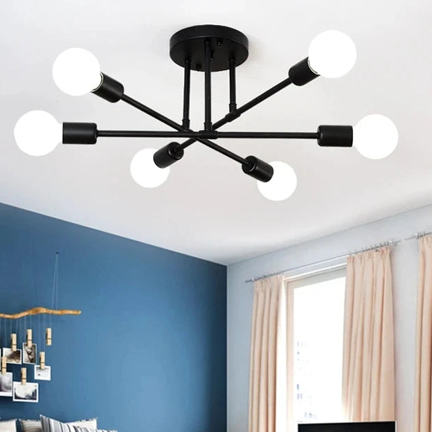 Astra Plafonnier à Bras – bras noirs et ampoules globes dans une pièce au mur bleu