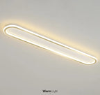 Piste Plafonnier LED Oblong – plafonnier doré et blanc allumé, vue en perspective