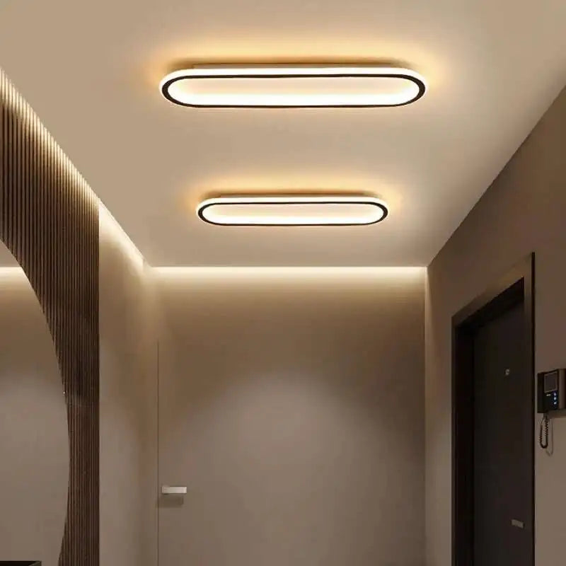 Piste Plafonnier LED Oblong – dans une pièce aux murs bruns