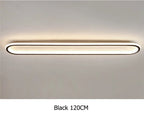Piste Plafonnier LED Oblong – plafonnier noir allumé, lumière chaude, vue de face