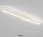 Piste Plafonnier LED Oblong – plafonnier blanc à liseré doré, vue en perspective
