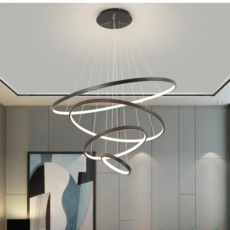 Orbite Suspension LED à Anneaux – anneaux gris dans un salon à plafond encadré