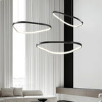 Orbite Trio Lustre 3 Anneaux LED Moderne – trois anneaux près d'une colonne noire