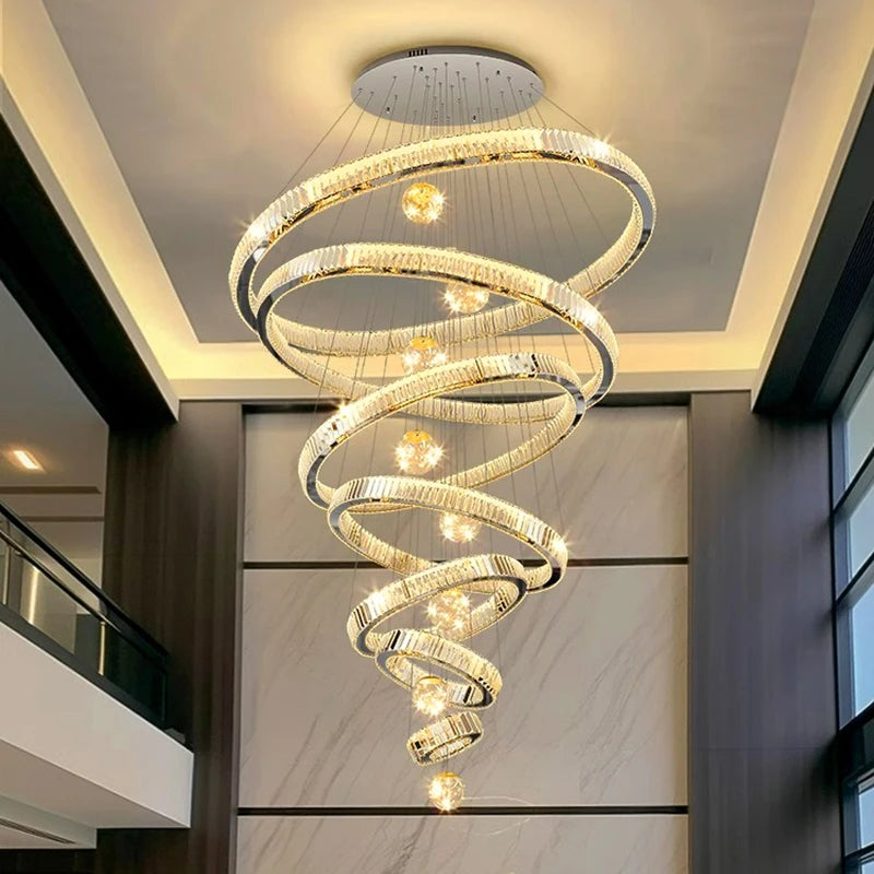 Saturne Lustre Anneaux en Cristal Moderne – lustre dans un hall avec garde-corps vitré
