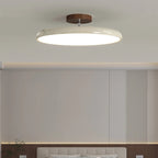 Médaillon Plafonnier LED Rond – disque crème dans une pièce aux murs gris