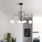 Arcadie Lustre à Bras en Arc – version noire dans une pièce blanche
