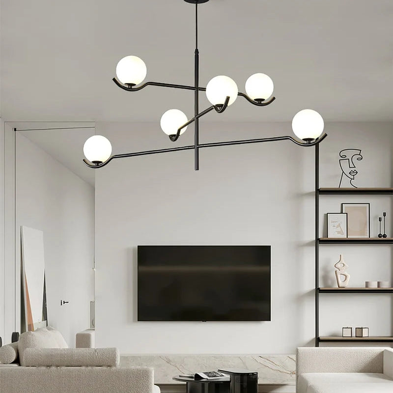 Perla Lustre à Globes en Verre – installé dans un séjour face à un meuble télé