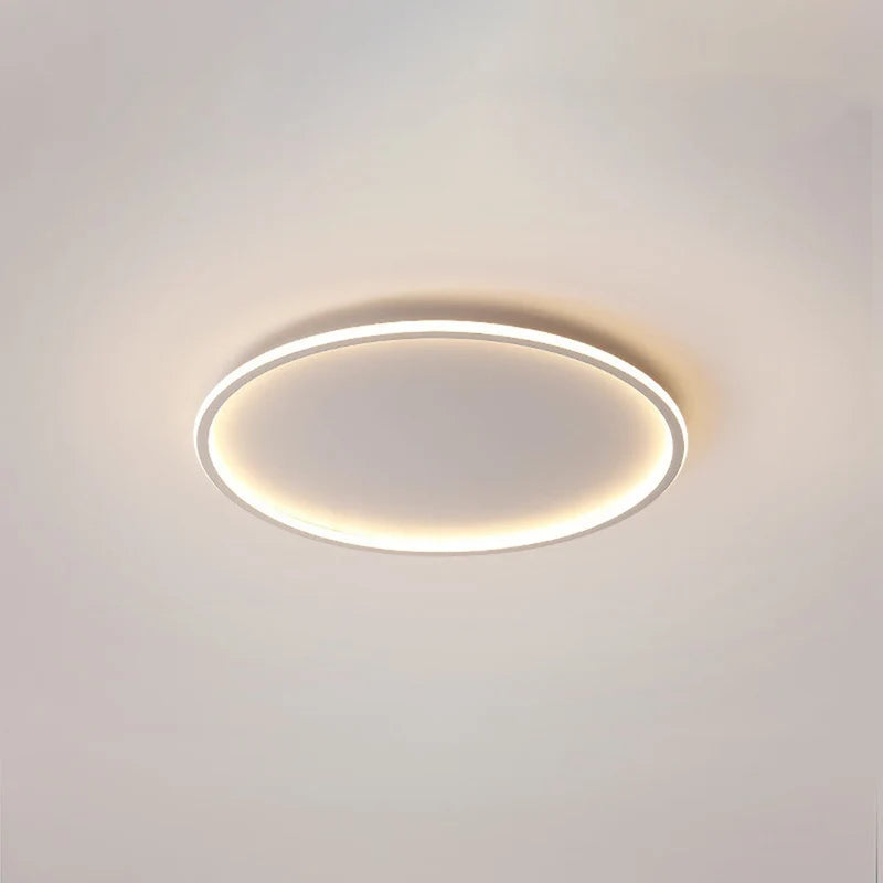 Halo Plafonnier LED Anneau – anneau LED noir allumé sur fond beige