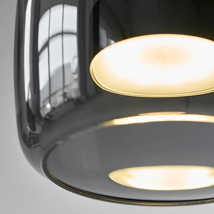 Ambrine Suspension en Verre Fumé ou Ambré, 1 Tête – gros plan du verre fumé vu de dessous, lumière intérieure